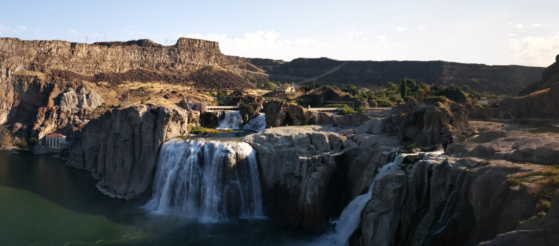 Displayed is a grand waterfall showing Bryan's love for nature. However, in the background a hydro plant can be seen to keep in mind that Bryan is still a true tech lover.